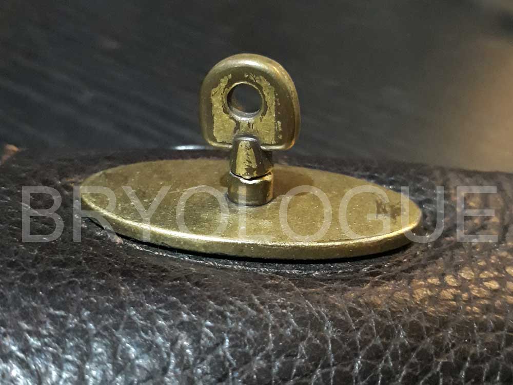 Profile shot of an authentic Mulberry postman's lock from a leather messenger bag