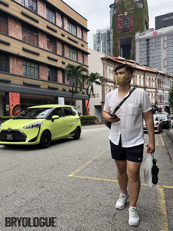 With an umbrella, a plastic bag of water and a bright car - Tanjong Pagar Road